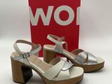 a close up of a pair of women ' s shoes on a white surface