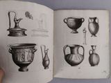 an open book with drawings of vases and vases on it