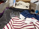 a box full of clothes and a pair of shoes
