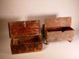 two wooden boxes sitting next to each other on a table