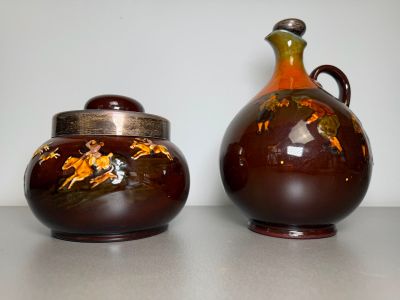 two vases that are sitting on a table