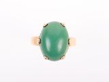 an image of a green jade ring on a white background