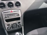 the interior of a car with a steering control and dashboard controls
