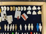 a shadow box with a bunch of small figurines in it