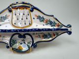 a blue and white bowl with a bird on it