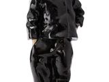 black and white figurine of a boy in a suit and hat