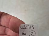 a hand holding a piece of paper with writing on it