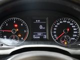 a close up of a car dashboard with various gauges