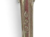 a close up of a spoon on a white surface