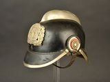 a helmet on a stand with a badge on it
