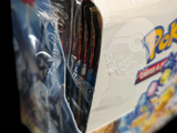 a box of pokemon trading cards sitting on a table