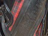a black bag with a red and black checkered design on it