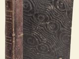 an old book that is sitting on a table