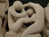 a sculpture of a group of people that are holding hands