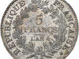 a silver five cents coin with a wreath on it