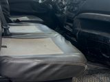 a picture of the inside of a van with the front seats down