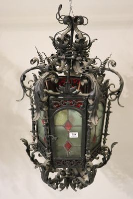 wrought iron hanging light fixture with stained glass panels