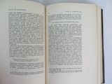 an open book on a table with a white background