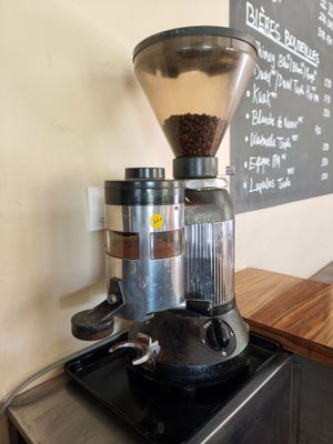 a coffee grinder sitting on top of a counter
