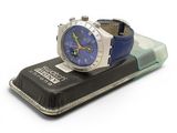 a watch sitting on top of a case on a white surface