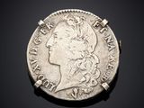 Pièce en argent avec la tête d'une femme de profil