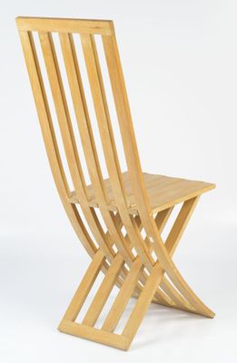 the chair is made of wood and has a wooden seat
