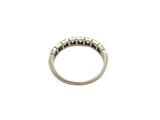 a close up of a silver ring on a white background