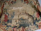 a very old piece of cloth with a picture of a giraffe on it
