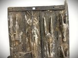 a wooden door that has a bunch of items on it
