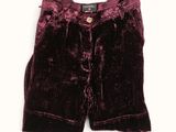 the shorts are made of velvet and have buttons on the front
