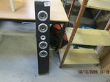 a speaker that is sitting on a shelf in a room