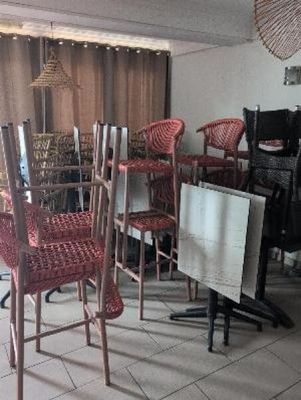 chairs and a table in a room with a large window