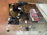 a glass display case with a lot of jewelry on it