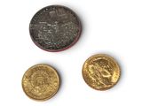 three different types of coins are shown on a white surface