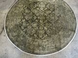 a large circular rug on the floor in a garage
