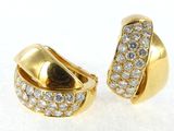 pair of yellow gold and diamond earrings on a white surface