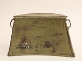 an old metal tray with a handle on a white background
