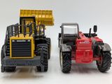 two toy trucks that are sitting next to each other