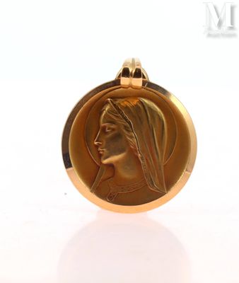 an image of a gold medal with a woman ' s face on it