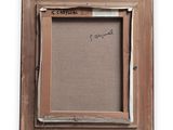 an old picture frame with a picture of a man on it