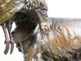 a statue of a goat with a bird on it ' s back