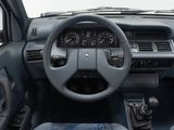 a dashboard of a car with a steering wheel and dashboard controls