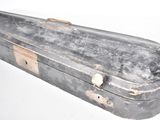 an old suitcase that is sitting on a white surface