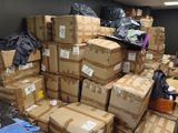 a large pile of boxes sitting in a room