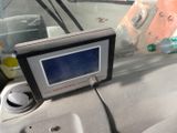 a car dashboard with a monitor on the dashboard