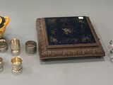 a lot of glass items on a table with a blue box