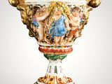 a vase that has a painting on it on it