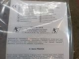 a plastic bag with instructions on it sitting on the floor