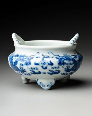 an image of a blue and white bowl with a handle
