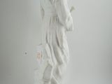 a statue of a woman holding a flower in her hand